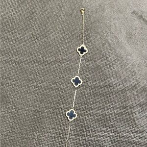 Elegant Gold and Black Clover Bracelet